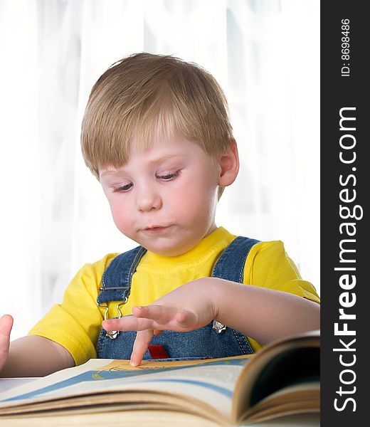 The child with books on the white background