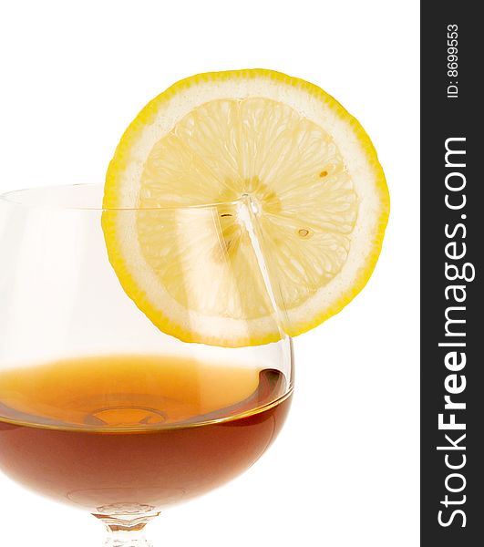 Goblet with cognac and segment of the lemon. Goblet with cognac and segment of the lemon