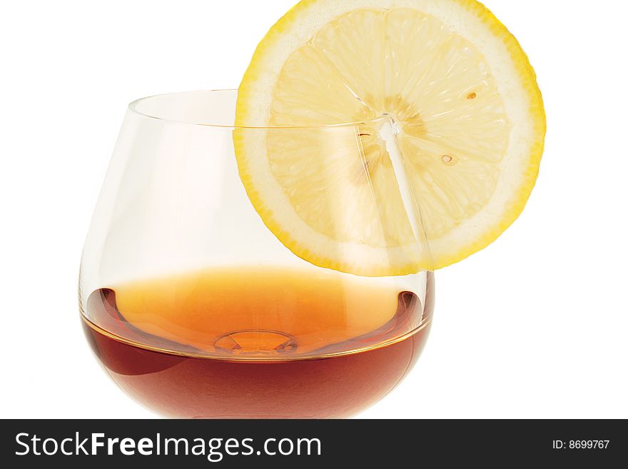 Goblet with cognac and segment of the lemon. Goblet with cognac and segment of the lemon