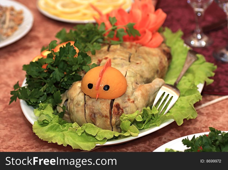 Stuffed chicken. Decoration of festive table.