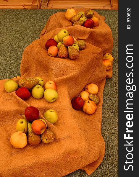 Apples, oranges and pears displayed over a sack. Apples, oranges and pears displayed over a sack