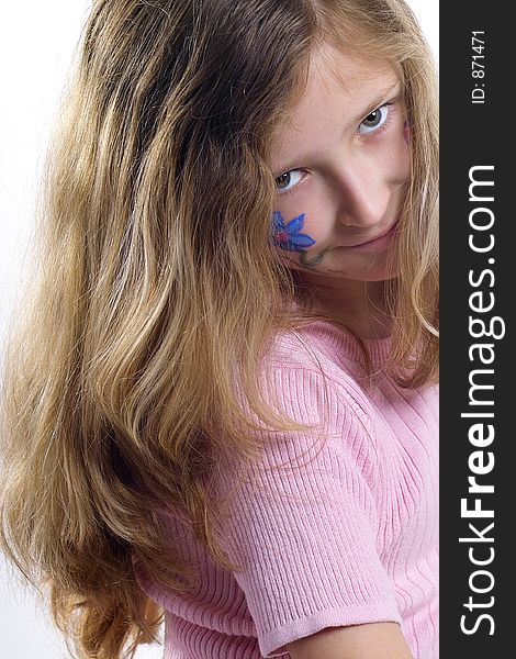 Beautiful young girl with a flower and butterfl drawing on her cheek. Beautiful young girl with a flower and butterfl drawing on her cheek