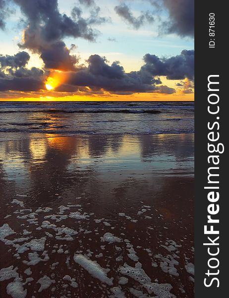 Sunset on a beach in the netherlands with golden colors. Sunset on a beach in the netherlands with golden colors