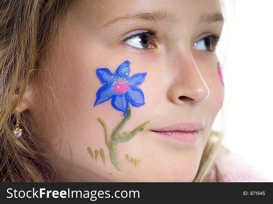 Beautiful young girl with a flower and butterfly drawing on her cheek. Beautiful young girl with a flower and butterfly drawing on her cheek