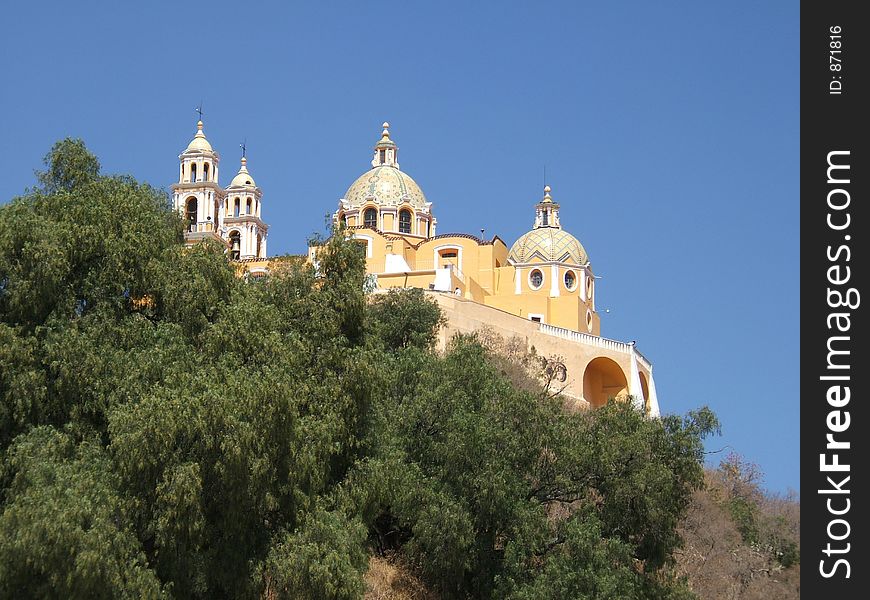 This is an image of a Mexican church perched on top of a hill. This is an image of a Mexican church perched on top of a hill.