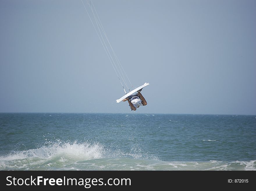 A kitesurfer gets fully airborne at Ponce Inlet Beach, Florida. A kitesurfer gets fully airborne at Ponce Inlet Beach, Florida