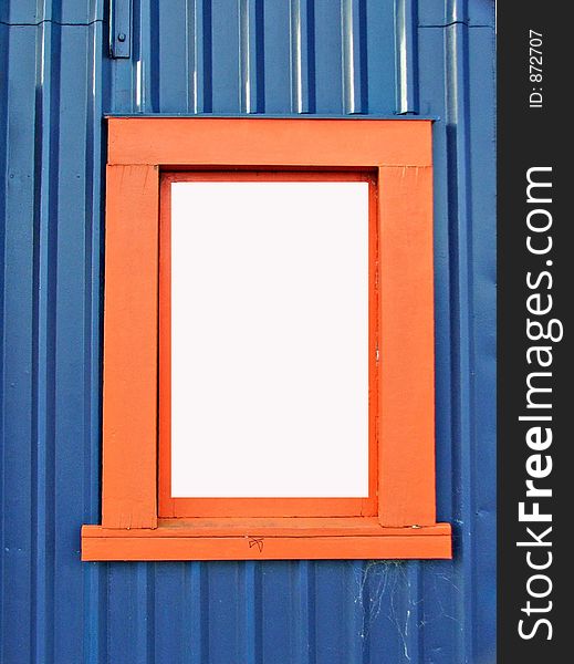 Orange window-frame against blue wall. Orange window-frame against blue wall
