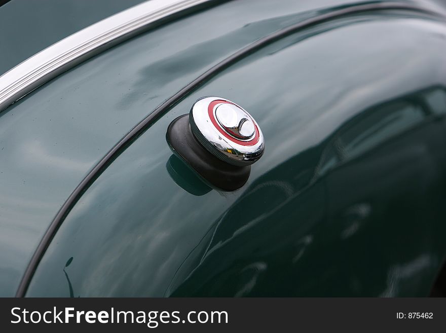 Photograph of  the petrol lid on an old classic car in mint condition, shining chrome and highly polished finish , absolutely beautiful. Photograph of  the petrol lid on an old classic car in mint condition, shining chrome and highly polished finish , absolutely beautiful