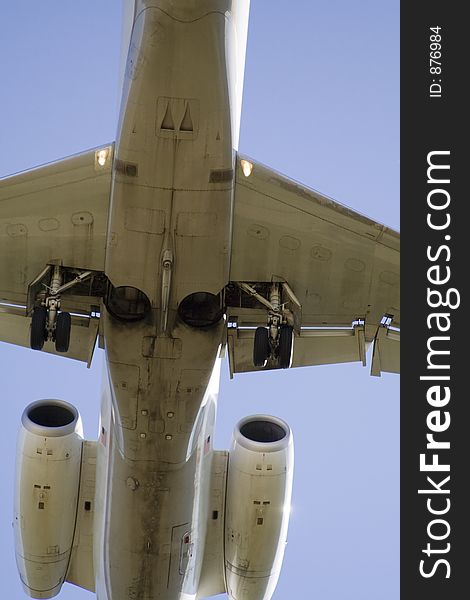 Underside of a Jet as it flys overhead close to the ground - approach for landing. Underside of a Jet as it flys overhead close to the ground - approach for landing.