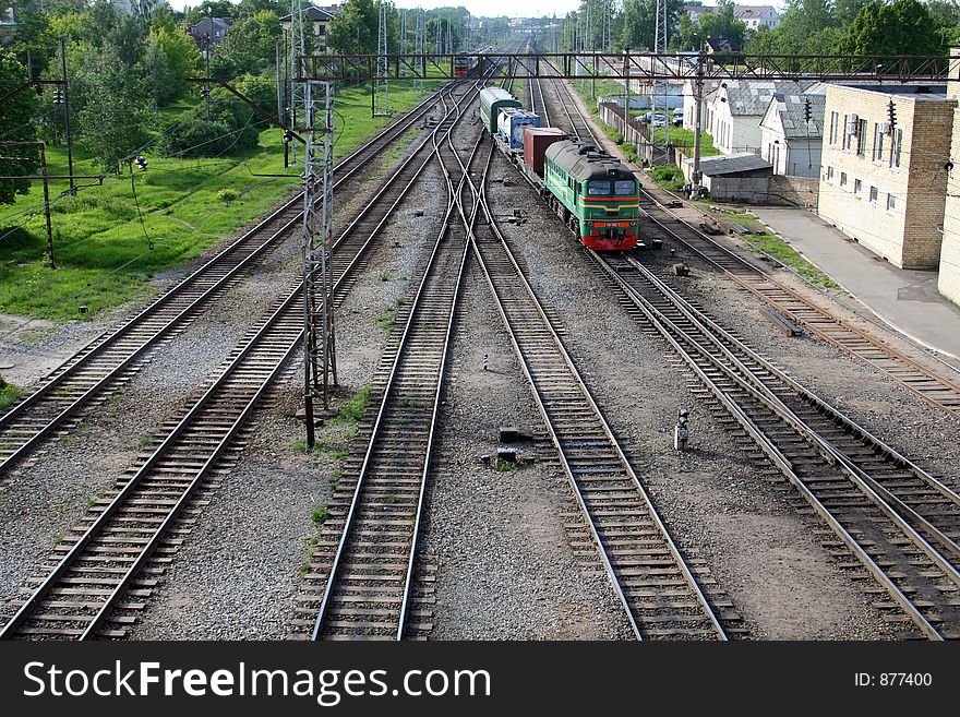 Flat railroad with coming train. Flat railroad with coming train
