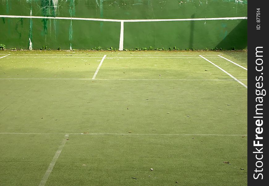 Old tartan tennis court with training wall. Old tartan tennis court with training wall