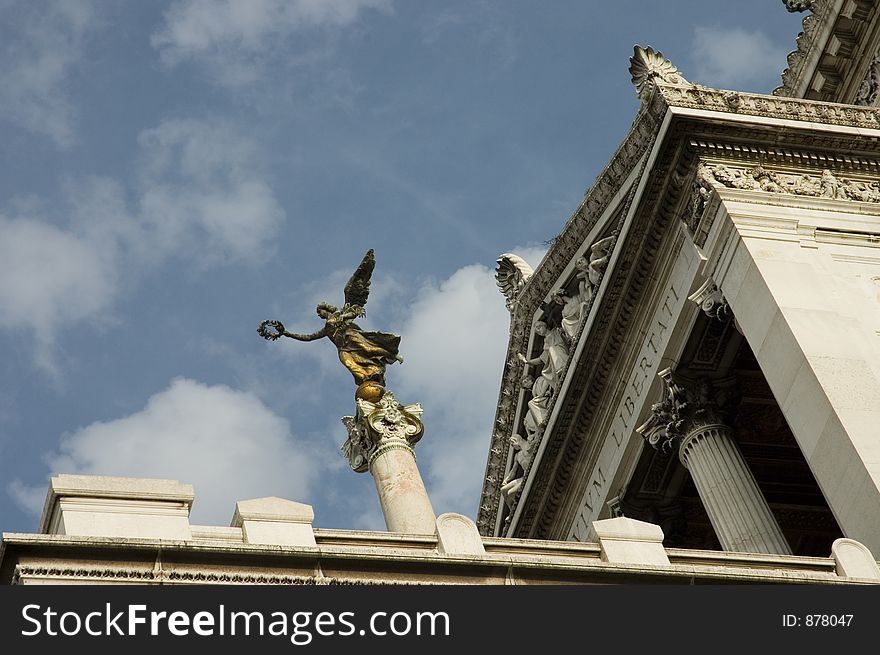 Bronze statue of a symbolic peace's angel over Victor Emmanuel II monument. also called Altare della Patria, fatherland's altar, a mausoleum, a tomb of an unknown soldier. Bronze statue of a symbolic peace's angel over Victor Emmanuel II monument. also called Altare della Patria, fatherland's altar, a mausoleum, a tomb of an unknown soldier.