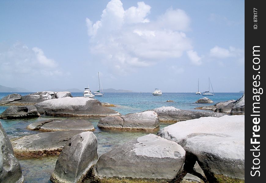 Boats on Devil's Bay past gigantic granite boulders at The Baths at Virgin Gorda, British Virgin Islands. If you can, please leave a comment about what you are going to use this image for. It'll help me for future uploads. Boats on Devil's Bay past gigantic granite boulders at The Baths at Virgin Gorda, British Virgin Islands. If you can, please leave a comment about what you are going to use this image for. It'll help me for future uploads.
