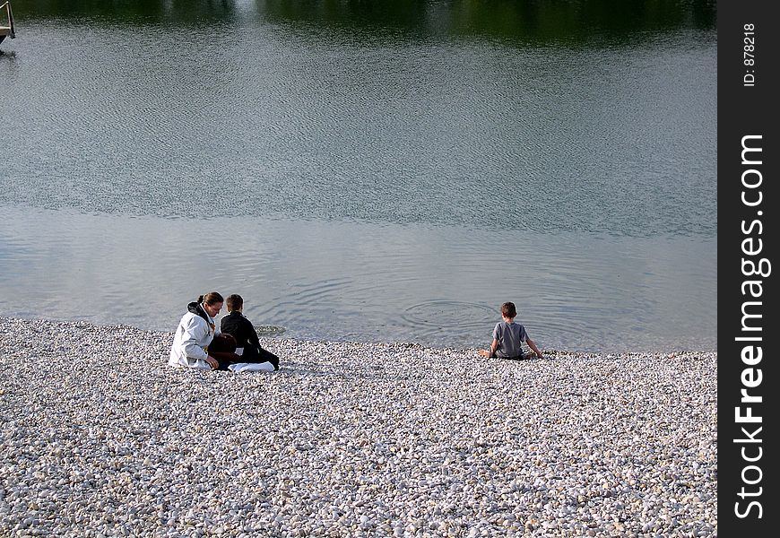 Mother and two young sons at lake. Mother and two young sons at lake