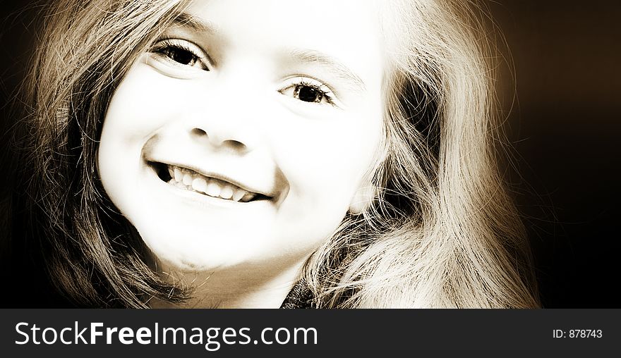 Blond girl smiling in sepia