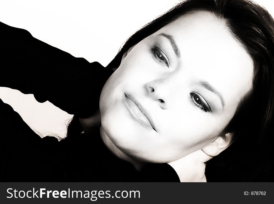 Dreamy young woman in polo-neck stretching - black and white finish. Dreamy young woman in polo-neck stretching - black and white finish