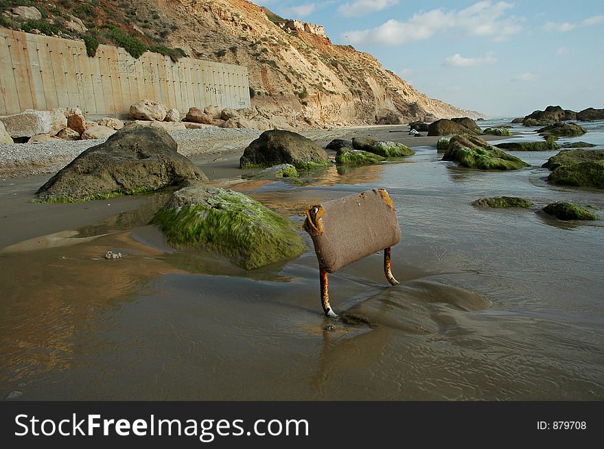 A sunken chair in the coast. A sunken chair in the coast