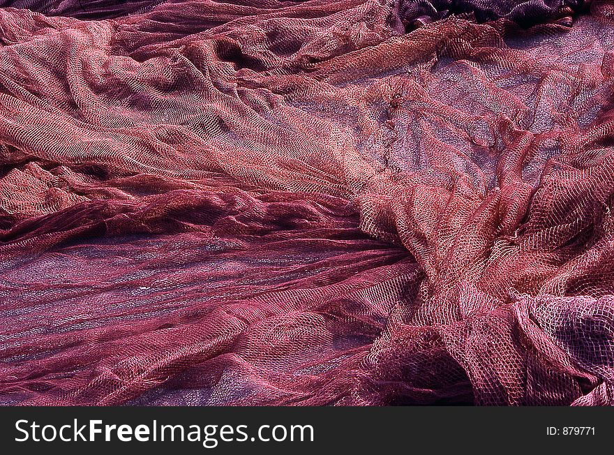 Colorful fishermens&#x27; nets drying out under the sun. Colorful fishermens&#x27; nets drying out under the sun.