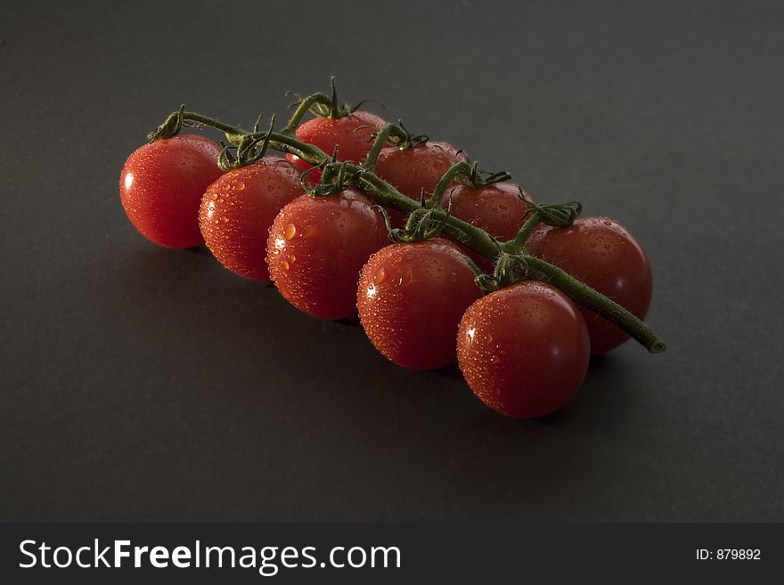 Cherry tomatoes with water drops.