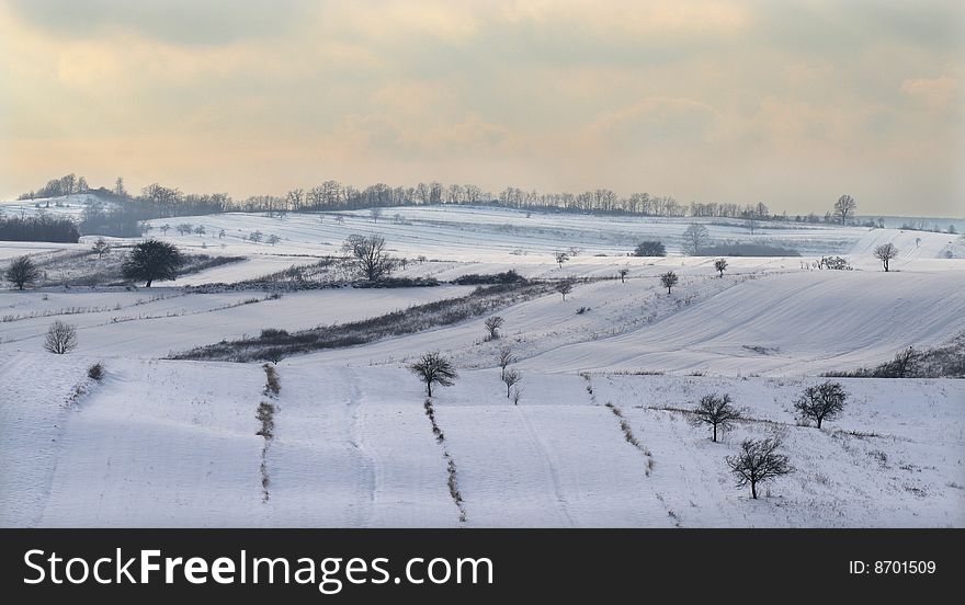 A view over a part of the Romanian countryside in winter. A view over a part of the Romanian countryside in winter