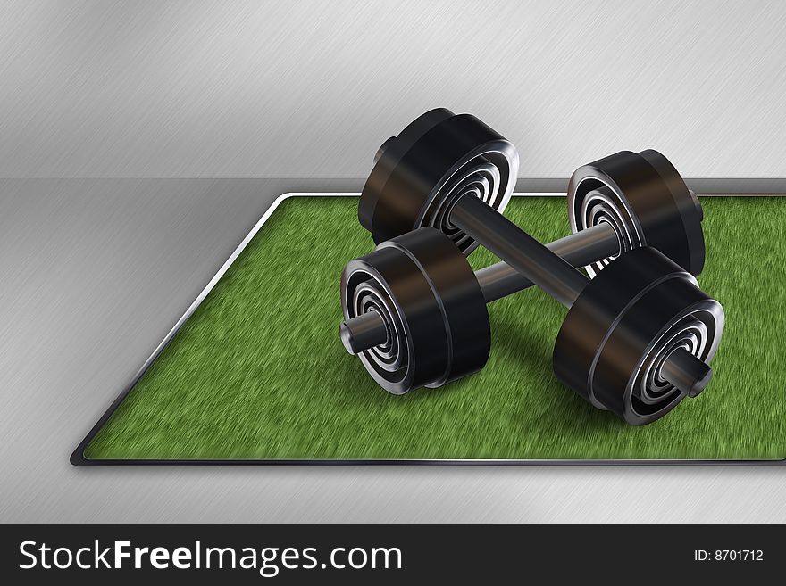 Heavy dumbbells on green mat in  	gym hall