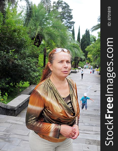 Portrait Of The Smiling Woman In Park.