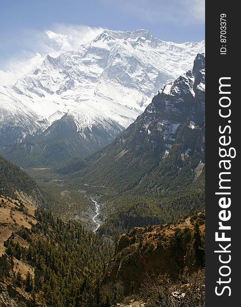 River flowing down from mountains with view over the Annapurnas. River flowing down from mountains with view over the Annapurnas