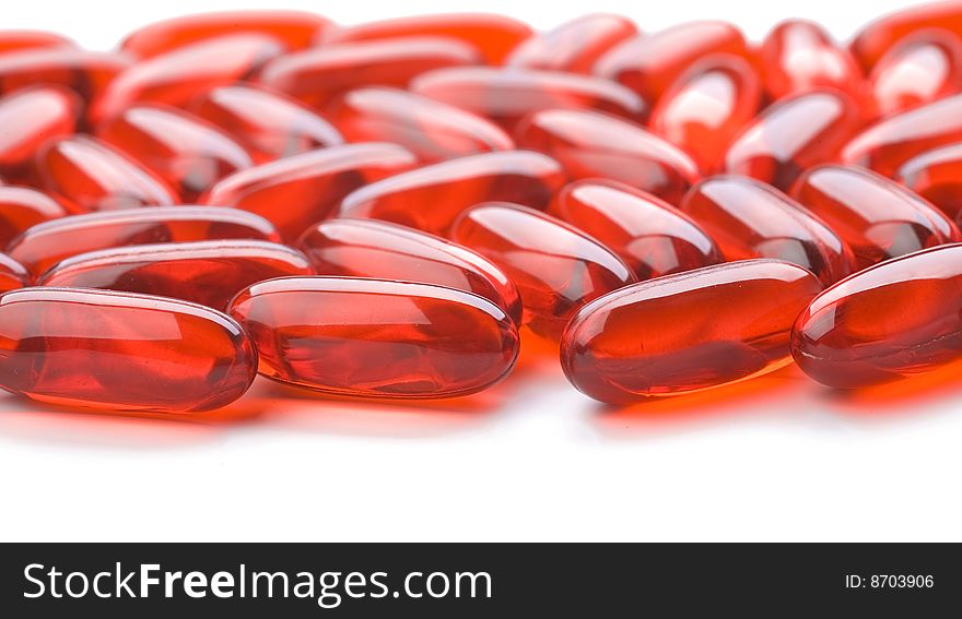 Red tablets isolated on white background