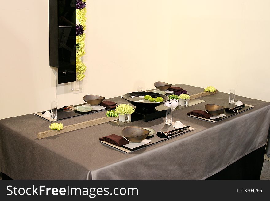 A beautiful table design in Japan. It is consisted of Japan traditional table wares such as dark-color dishes and chopsticks.