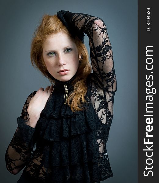 Beautiful fashion redheaded girl with hands around face. Beautiful fashion redheaded girl with hands around face