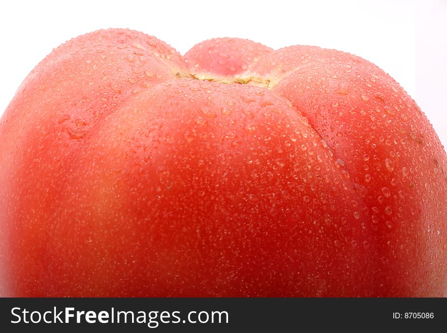 Close-up of a tomato on white background.