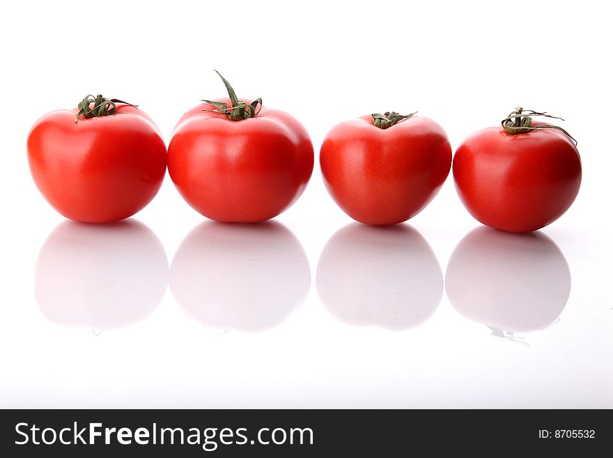 Tomatos in raw on a white background