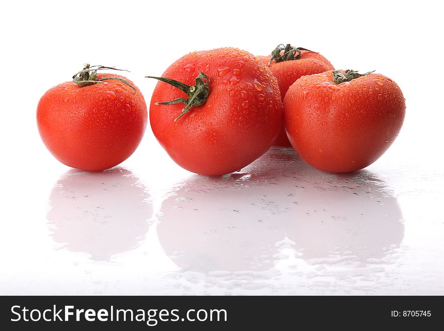 Tomatos in drops of water. Tomatos in drops of water