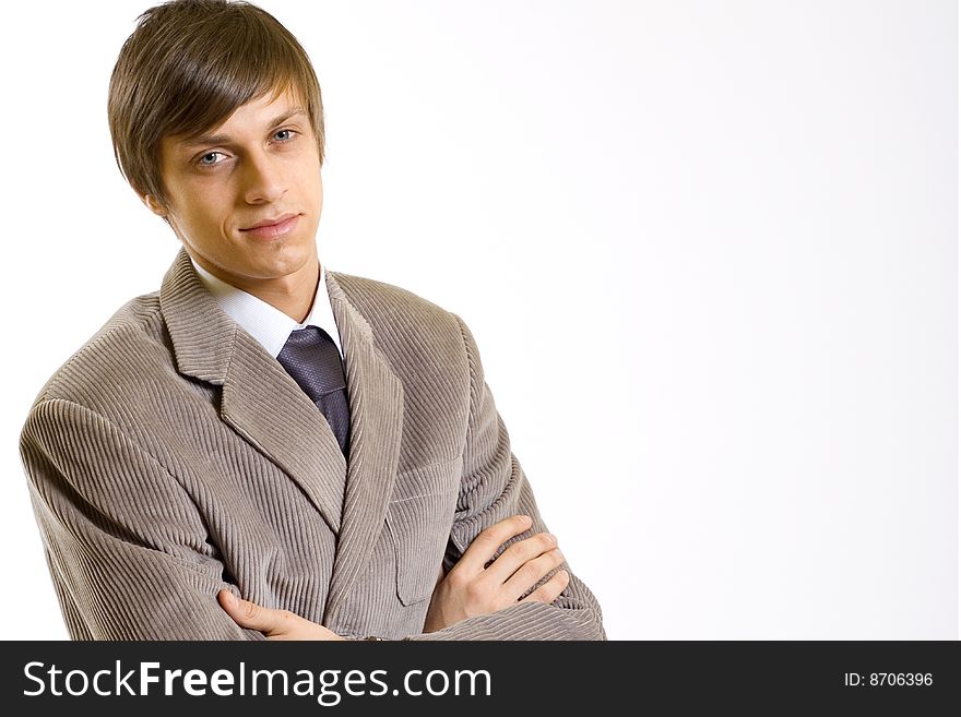 Portrait of a smiling young business man with hands crossed. Portrait of a smiling young business man with hands crossed