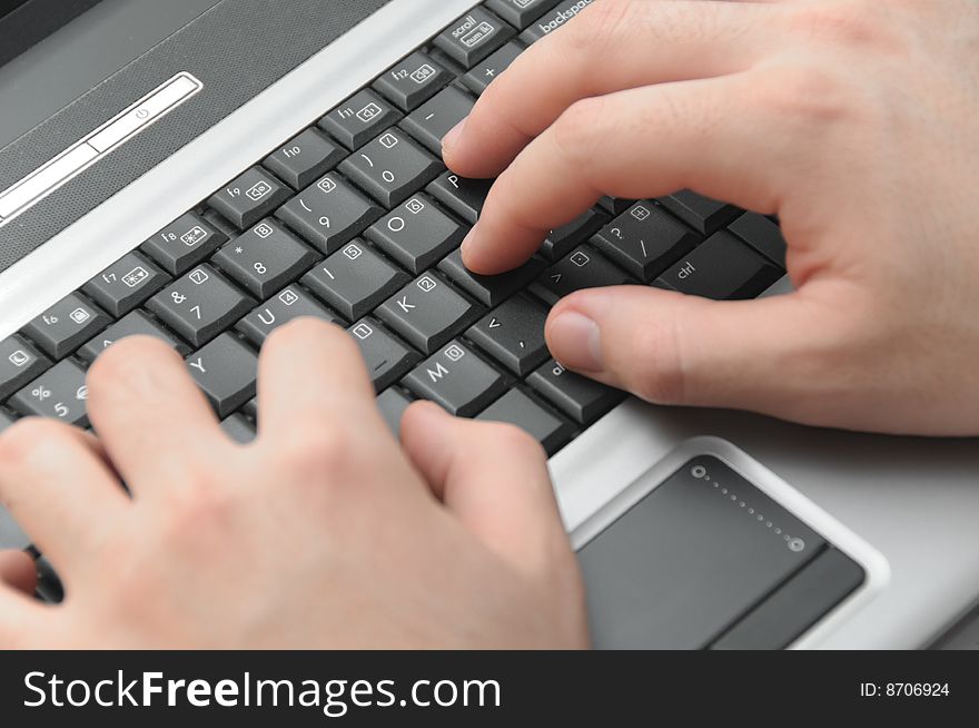 Businessman Typing On Notebook