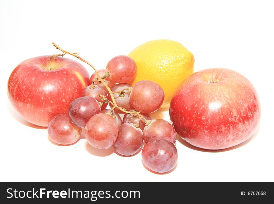 Grapes and apples on a white background. Grapes and apples on a white background