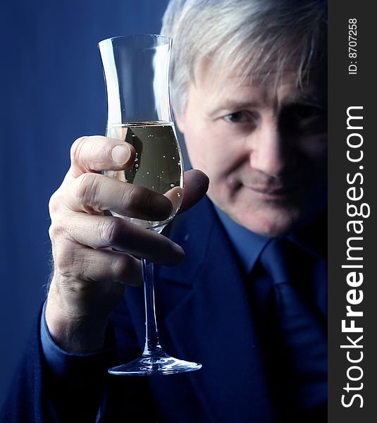 Portrait of a senior man with a glass of wine. Portrait of a senior man with a glass of wine