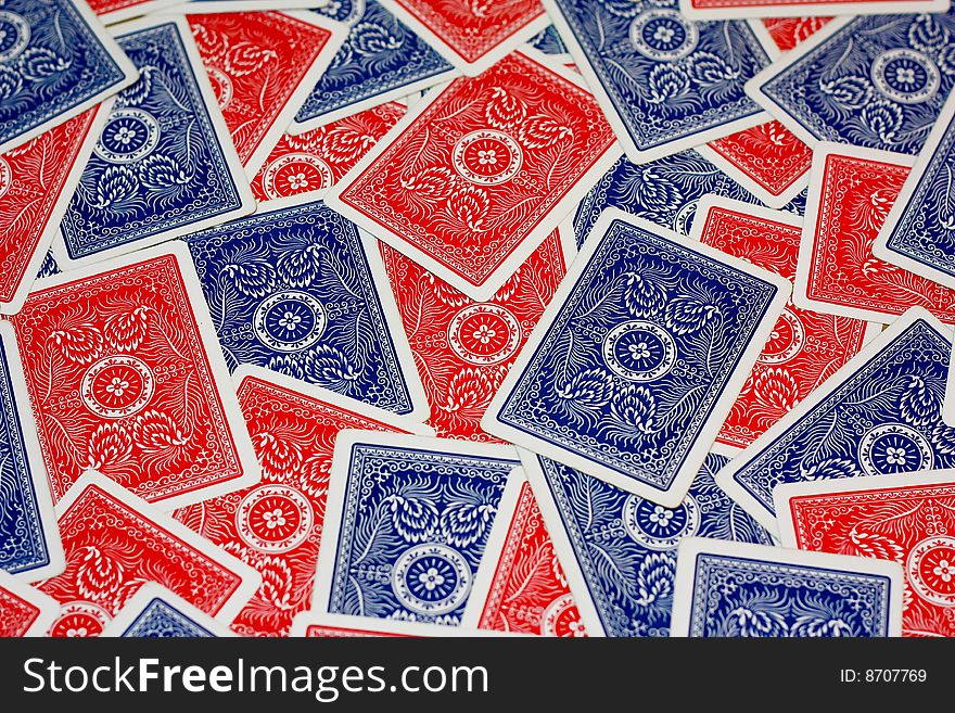 Red and blue playing cards mixed up. Red and blue playing cards mixed up