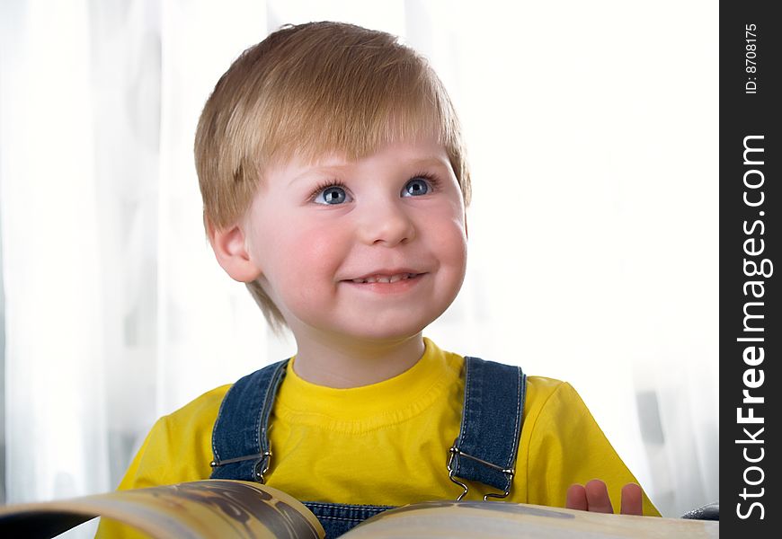 The child with books on the white background