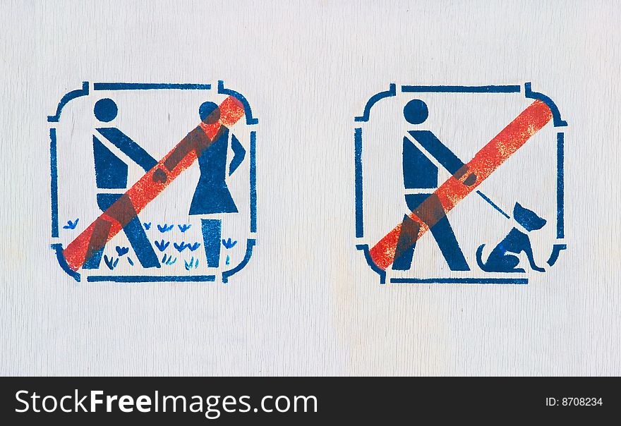 Forbidding pictograms on board in park. Forbidding pictograms on board in park