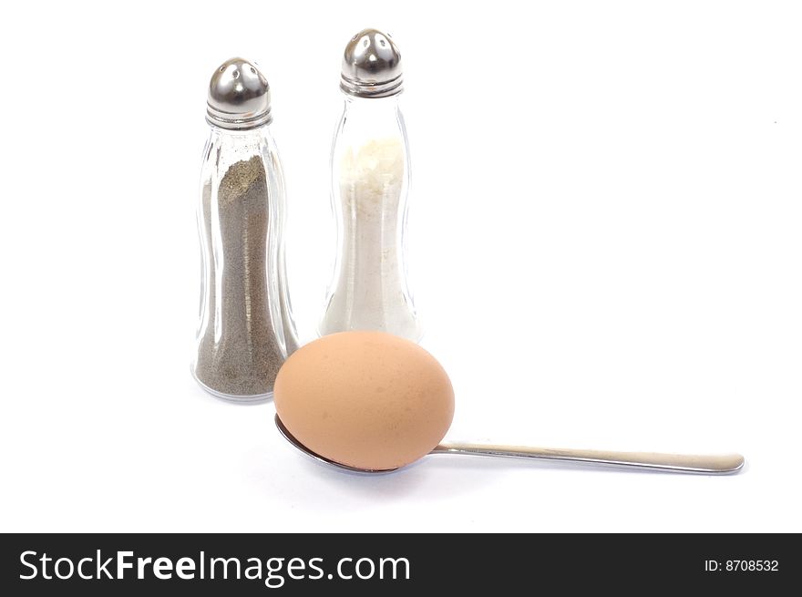 Egg with sald and pepper on white background