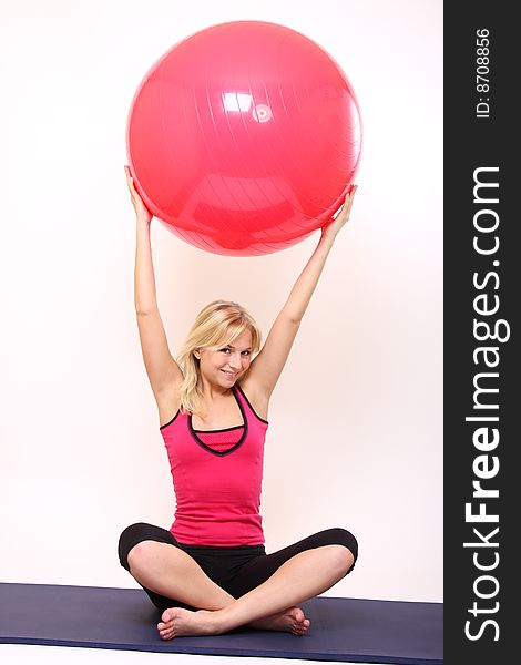 Young woman doing exercise with fit-ball. Young woman doing exercise with fit-ball