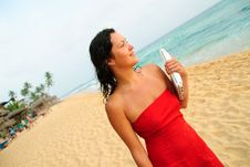 Beautiful Smiling Young Woman With Laptop On Beach Stock Photography