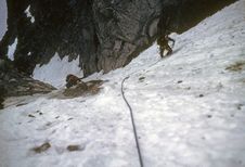 Climbers On Steep Snow Face Stock Photography