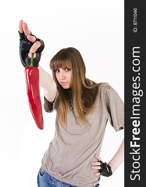 Young blue eyes girl with red paprika in hand.