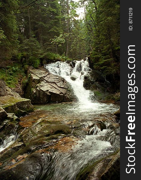 Running water, small mountain stream and small waterfall