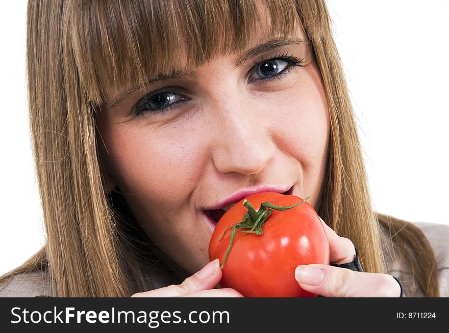Young girl with fresh red tomato in hand. Young girl with fresh red tomato in hand.