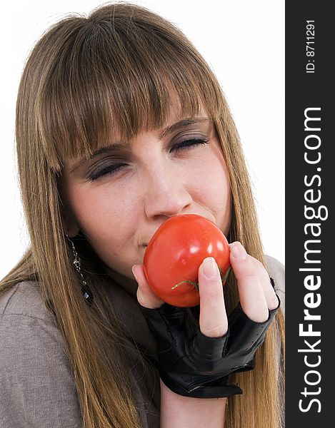 Young girl with fresh red tomato in hand. Young girl with fresh red tomato in hand.