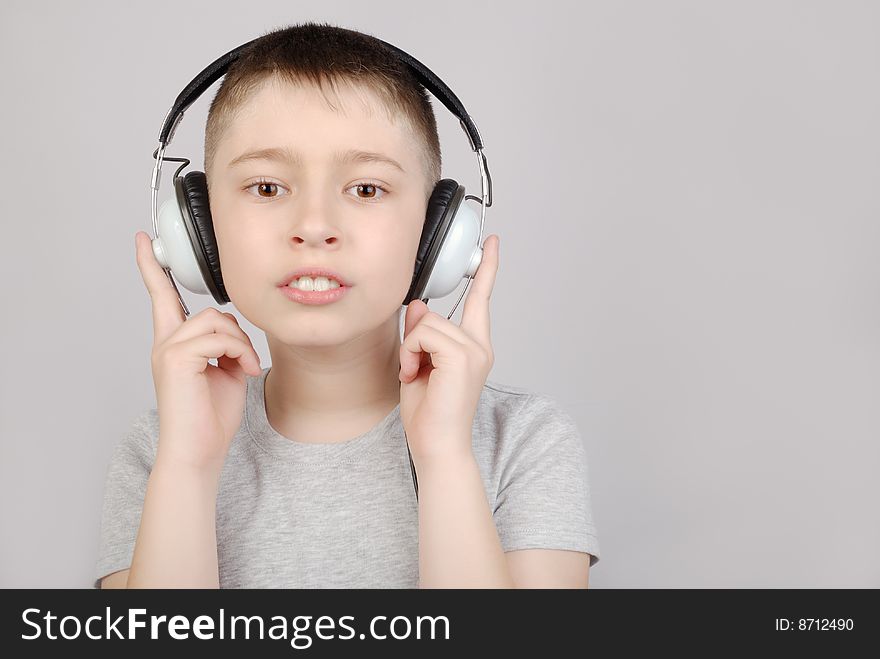 Boy in headphones with copy space. Boy in headphones with copy space