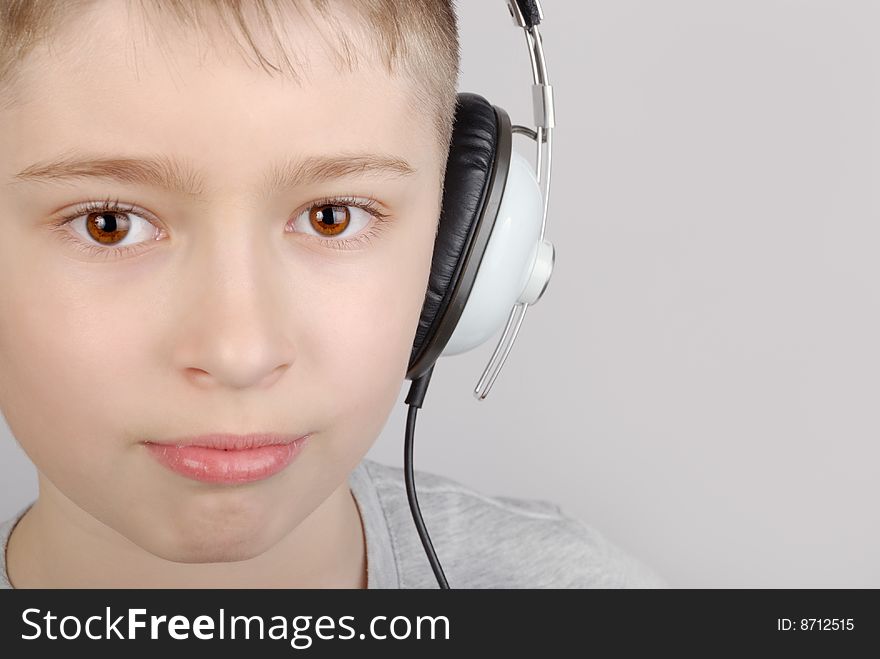 Boy in headphones with copy space. Boy in headphones with copy space